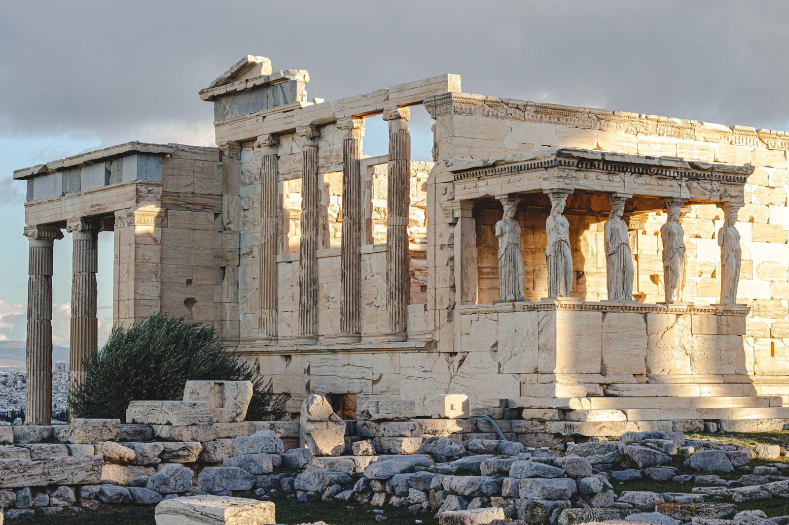 Ancient Erechtheion temple with caryatids at the Acropolis in Athens, Greece, illuminated by sunlight