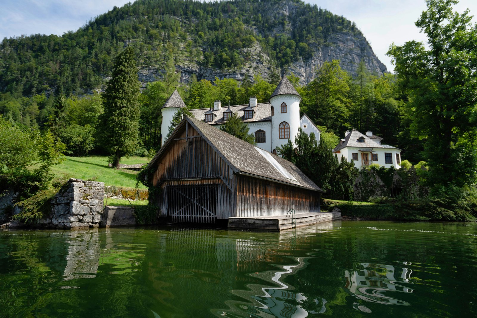 Schloss Grub (Grub Castle) and its historic boathouse on the eastern shore of Lake Hallstatt -Salzkammergut region of Austria
